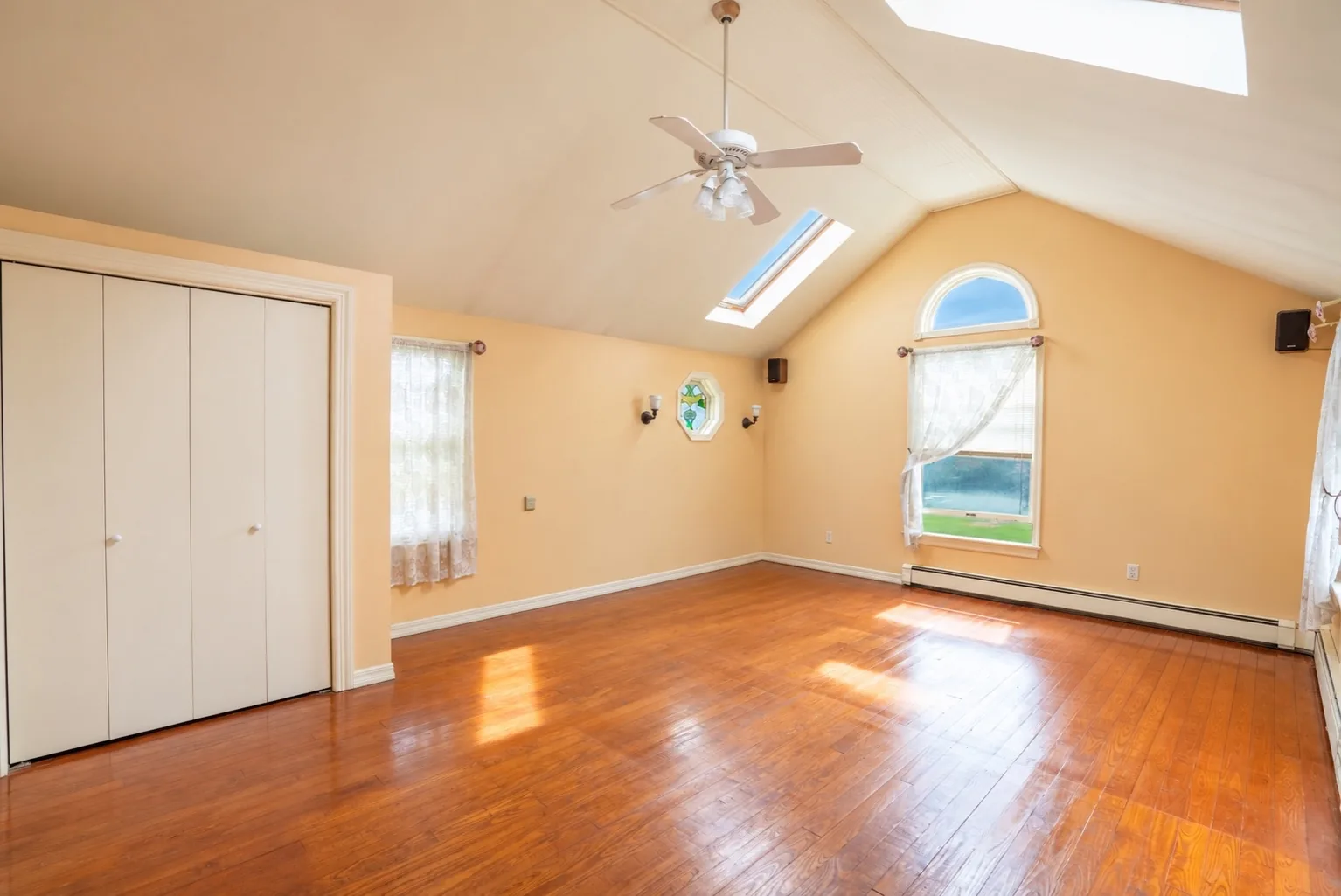 Original cathedral-ceiling primary bedroom